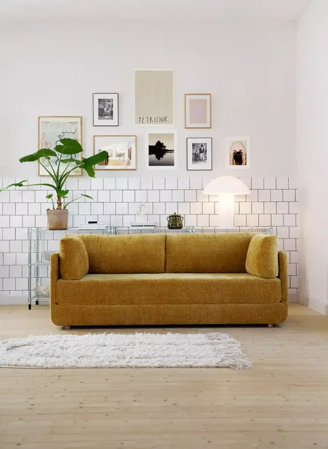 STINA_interior_3seater_sofa_bed_bloom_3_warm_yellow_1_domatoria_katowice_sofa_sits_stina.webp