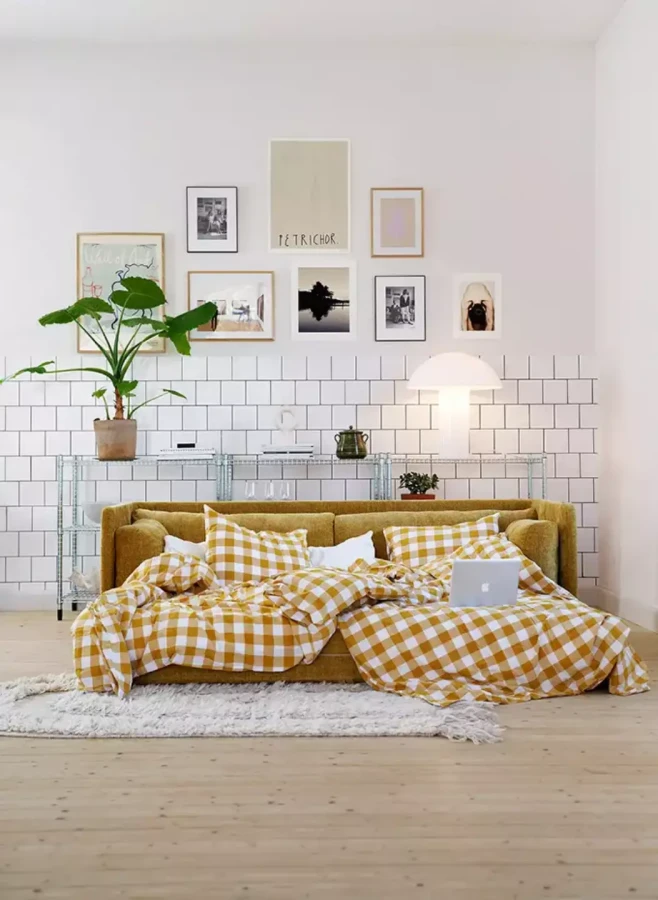 STINA_interior_3seater_sofa_bed_bloom_3_warm_yellow_2_domatoria_katowice_sofa_sits_stina.webp