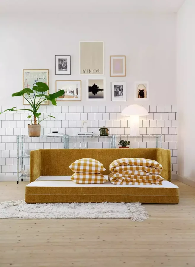 STINA_interior_3seater_sofa_bed_bloom_3_warm_yellow_4_domatoria_katowice_sofa_sits_stina.webp